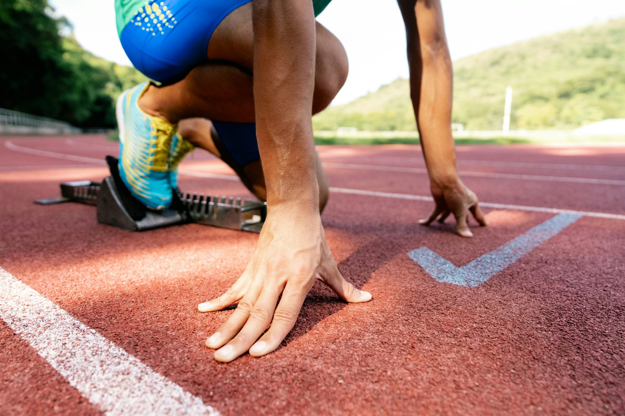 Empty athletic starting line on a track, representing measurable quarterly targets
